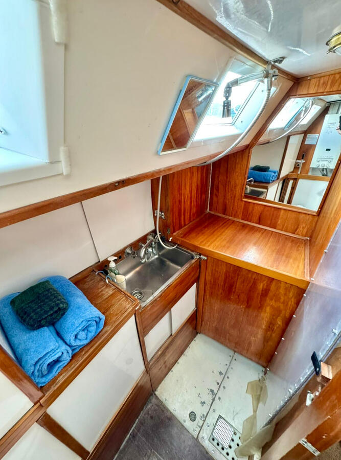 Shower and vanity looking aft Shower and vanity looking aft