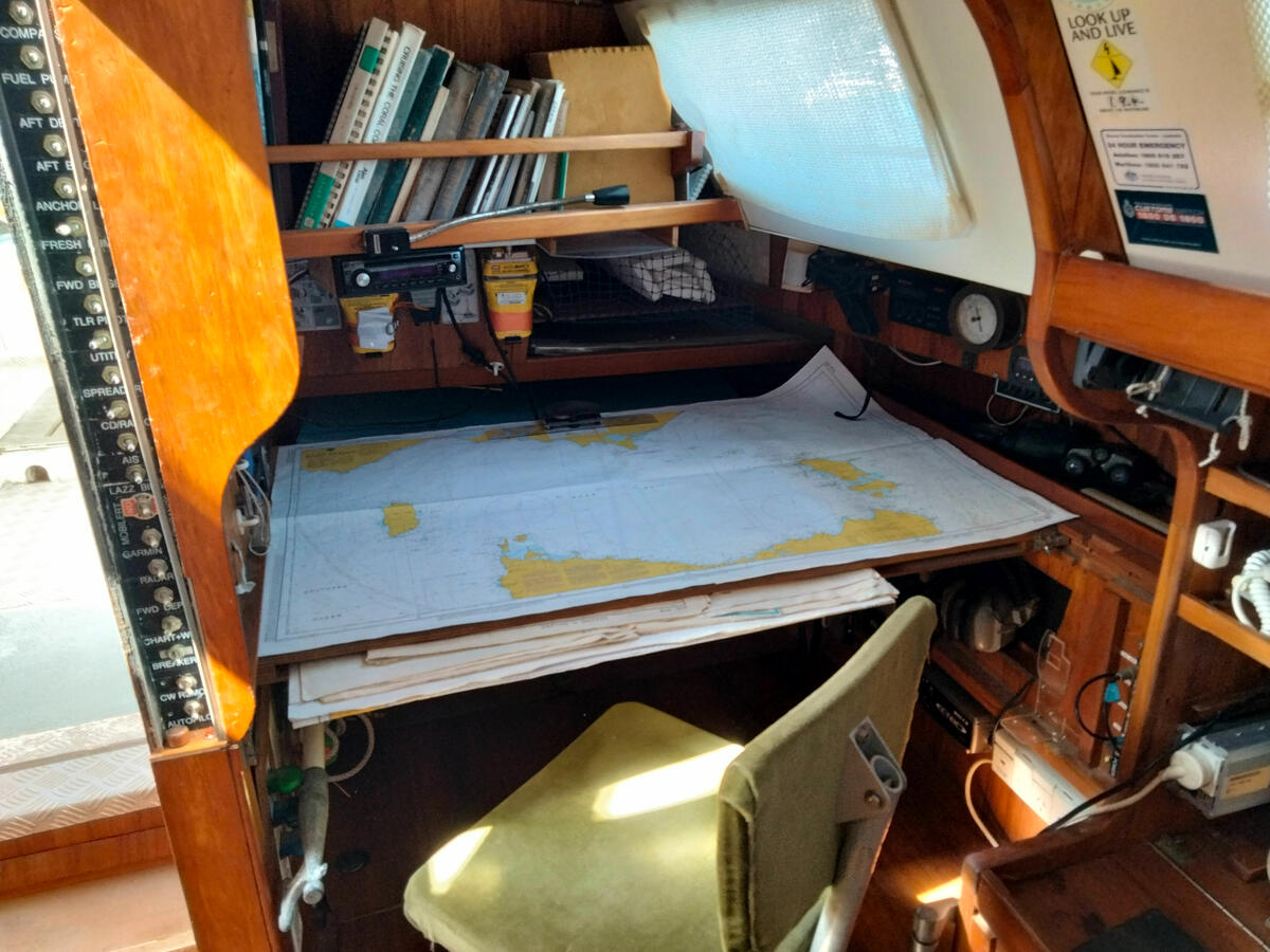 Sliding full size chart table above port quarterberth Sliding full size chart table above port quarterberth